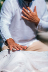 Reiki healing session. woman lying with her eyes closed, having reiki healing treatment.