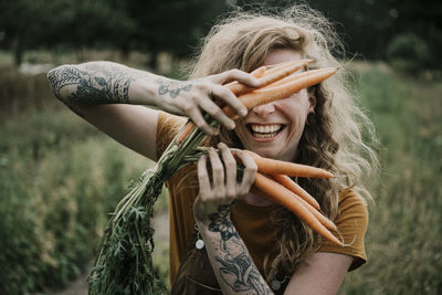 Cropped image of woman holding wheat