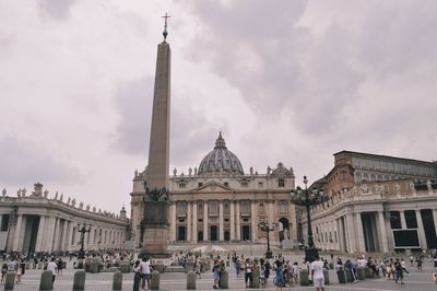 Group of people in front of historical building