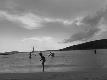 Silhouette of people on beach