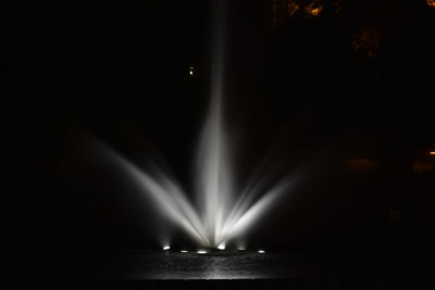 Illuminated lights in water at night