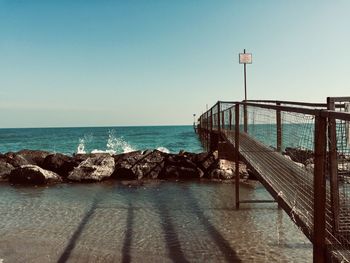 Scenic view of sea against clear blue sky