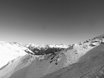 Scenic view of snow covered mountains against clear sky