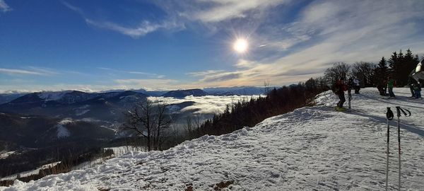 Scenic view of snow covered mountains against sky