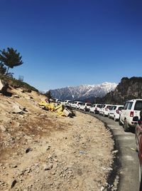 Scenic view of road against clear blue sky