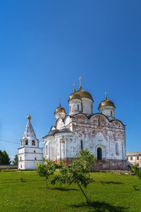 Low angle view of church against clear blue sky