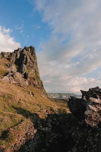 Rock formation on land against sky