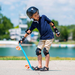 Full length of a boy playing with water