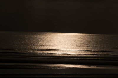 Scenic view of sea against sky at sunset