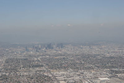 Aerial view of cityscape against sky