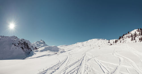 Scenic view of snowcapped mountains against sky