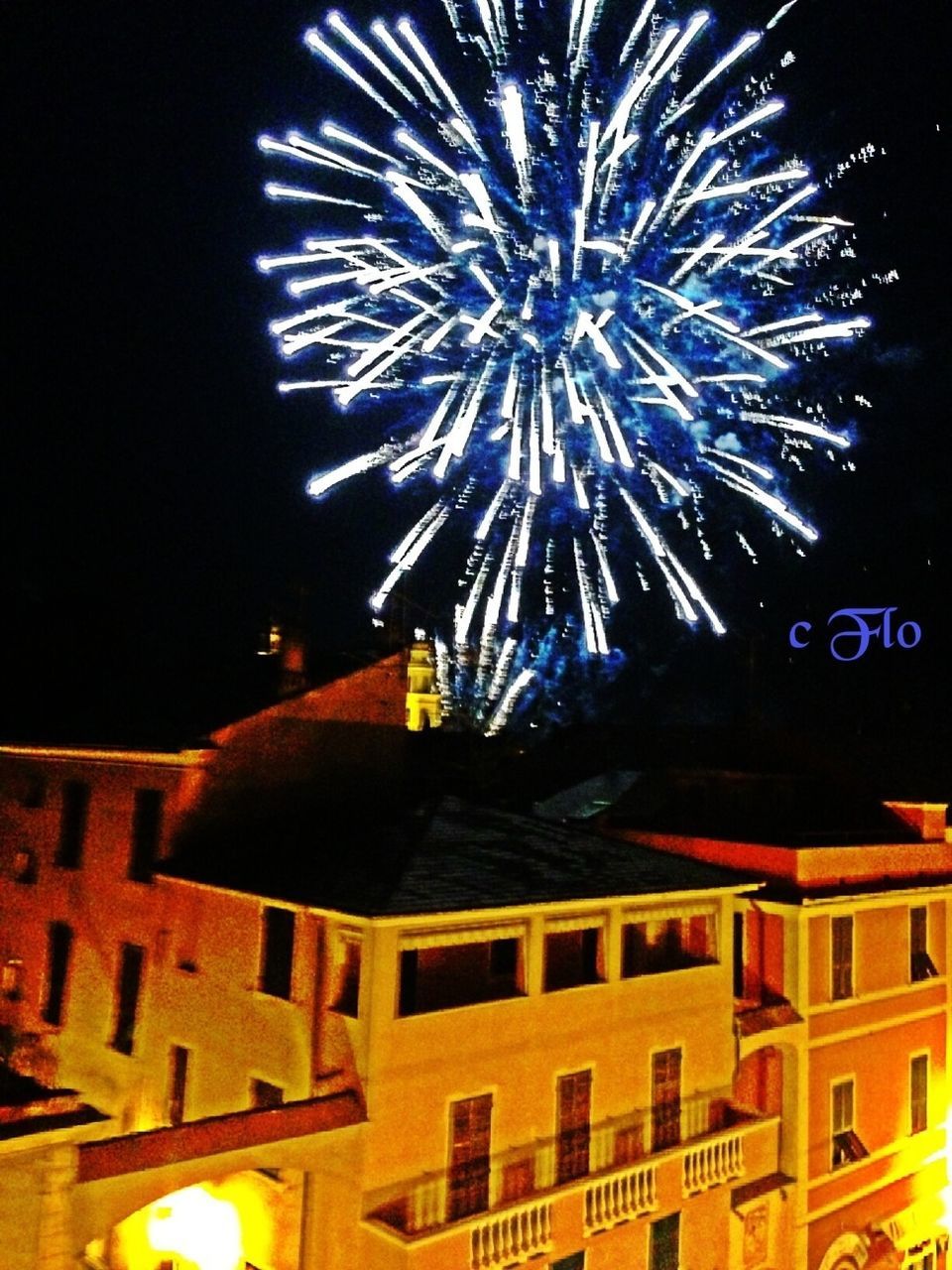 illuminated, night, firework display, celebration, exploding, building exterior, long exposure, architecture, firework - man made object, arts culture and entertainment, low angle view, glowing, built structure, motion, multi colored, sparks, event, firework, entertainment, sky