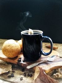 Close-up of coffee cup on table