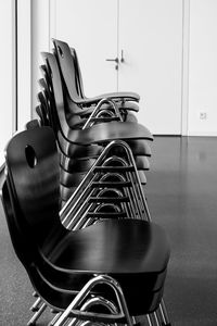 Close-up of chairs on table at home