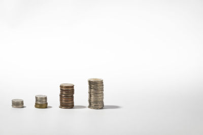 Stack of coin against white background