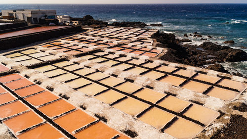 High angle view of city buildings by sea