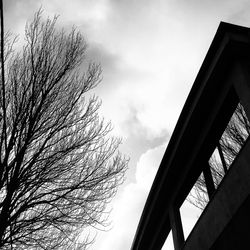 Low angle view of building against cloudy sky