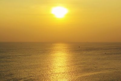 Scenic view of sea against clear sky during sunset