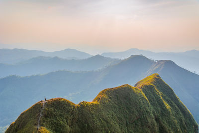 View of mountain range against cloudy sky