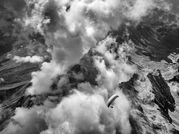 Low angle view of bird flying against sky