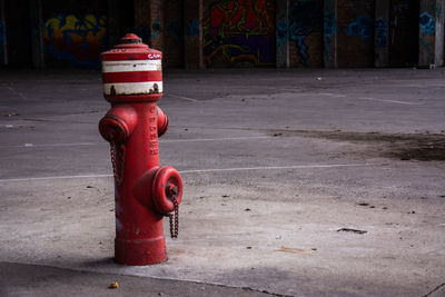 Red fire hydrant on sidewalk