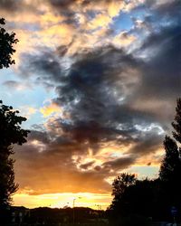 Low angle view of dramatic sky during sunset