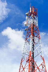 Low angle view of communications tower against sky