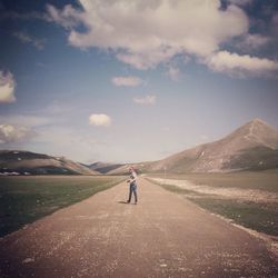 Man on landscape against clear sky