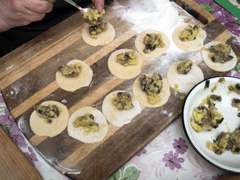 High angle view of person preparing food on cutting board