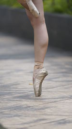 Low section of woman ballet shoes