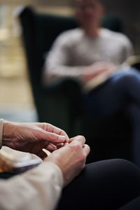 Female patient wringing hands at therapy session