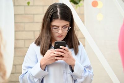 Young woman using mobile phone