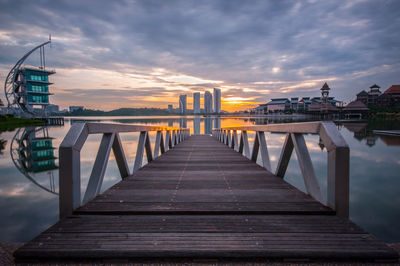 View of bridge in city at sunset