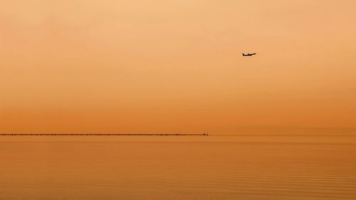 Scenic view of sea at sunset