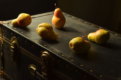 Pears on top of vintage trunk