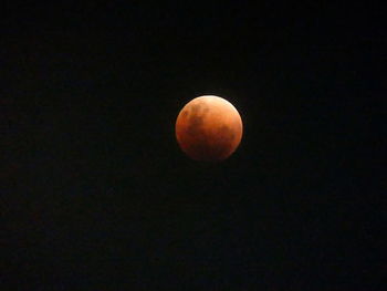 Low angle view of moon against clear sky at night