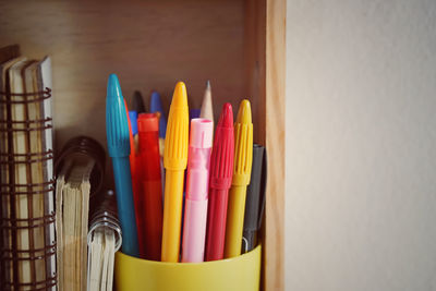 Close-up of multi colored pencils on table