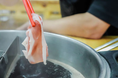 Close-up of hand holding ice cream