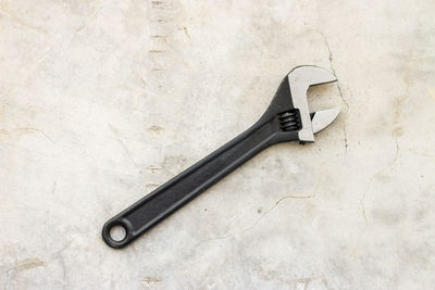 High angle view of wrench on floor