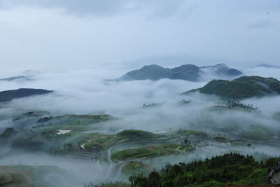 Fog covered fields and mountains