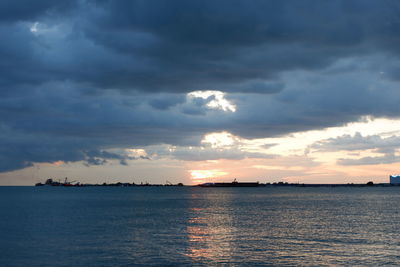 Scenic view of sea against dramatic sky