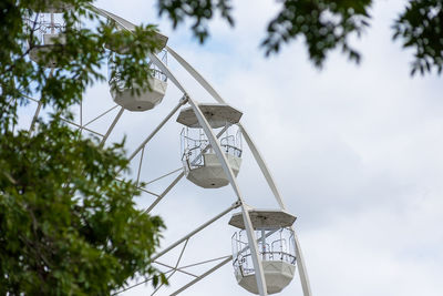 Low angle view of ferris wheel against sky