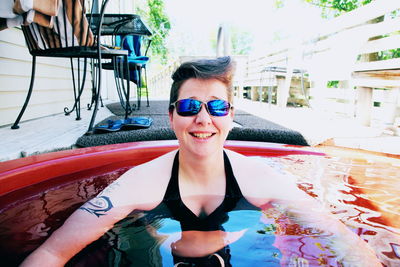 Portrait of young woman wearing sunglasses