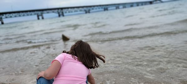 Rear view of woman on beach