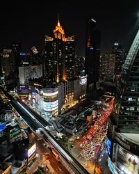 High angle view of illuminated buildings in city at night