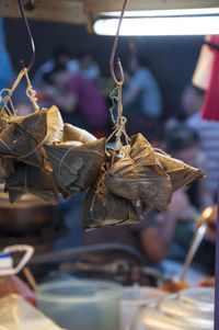 Close-up of dry leaves hanging on table