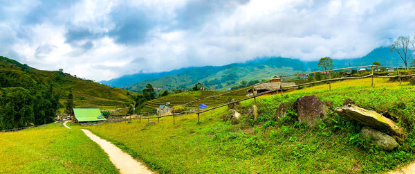 Panoramic view of road amidst mountains against sky