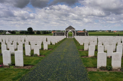 View of cemetery against cloudy sky