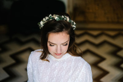 Portrait of beautiful young woman standing outdoors