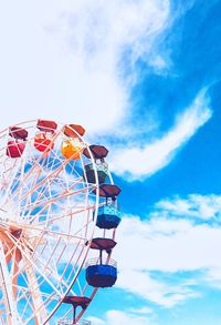 Low angle view of ferris wheel against sky